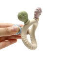 Montessori silicone teething ring with bunny head and textured handle in hand