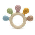 Montessori silicone teething ring with five colorful textured attachments in soft pastels.